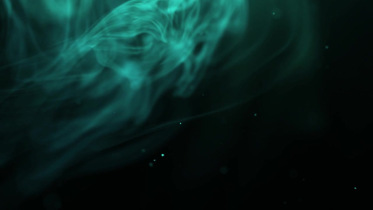 Elegant Wisps of Blue Smoke and Particles Against Black Background