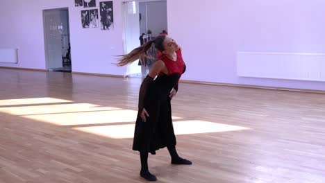 Female-dancer-stretching-before-dancing