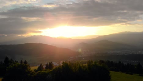 aerial beautiful young happy girl women cheering towards golden sunset over gorgeous mountain landscape