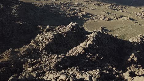 Sandstone-Formations-in-Alabama-Hills-and-Desert,-California-USA,-Drone-Aerial-View-on-Golden-Hour