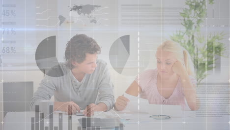 animation of financial data processing over caucasian couple paying bills