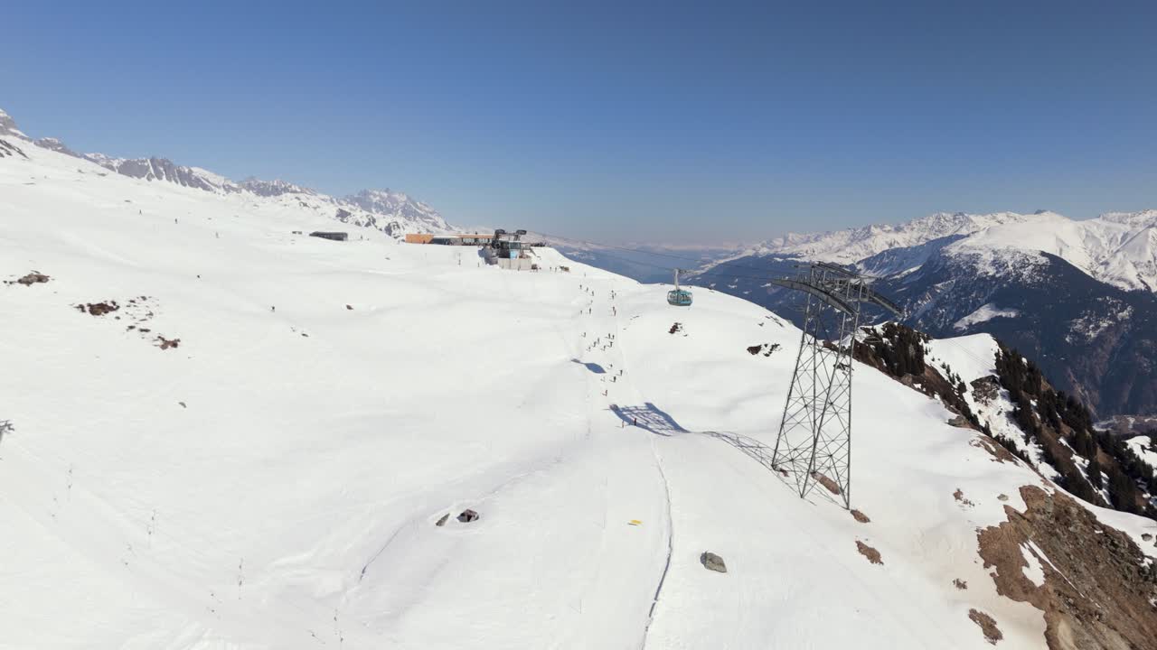 Cuolm da Vi Gondola from Sedrun to Disentis descendig, approaching a tower