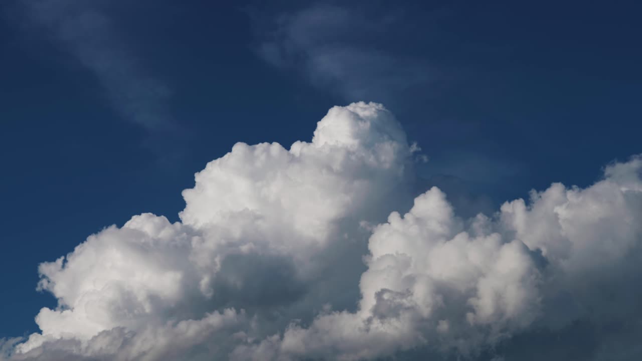 Large White Cumulus Clouds in a Deep Blue Sky