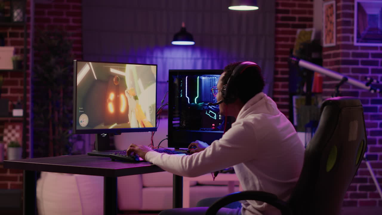 Statict tripod shot of african american gamer streaming first person shooter while explaining gameplay