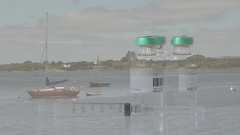 syringe and vials on table with animation of tranquil harbor and sailboats