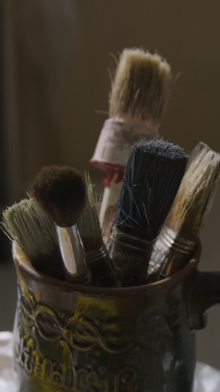 Paint Brushes in Ceramic Container