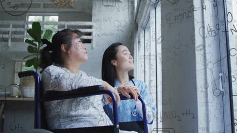 animation of chemical data over asian female nurse with patient in wheelchair talking