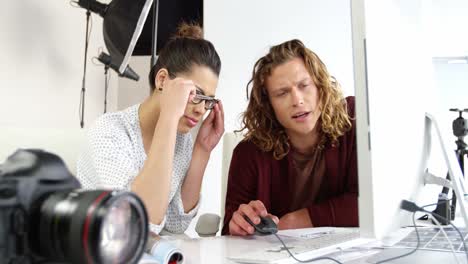 photographers having discussion on personal computer