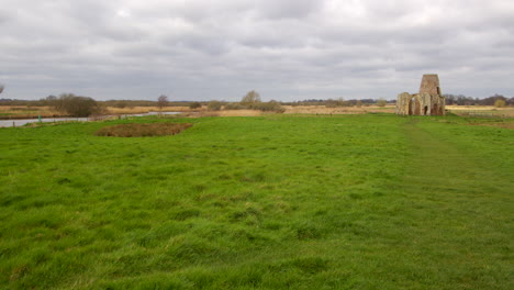 Wide-shot-of-St-Benet’s-abbey-16th-century-gatehouse-with-18th-century-windmill