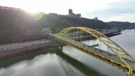 sun shining on fort pitt bridge in pittsburgh, pennsylvania