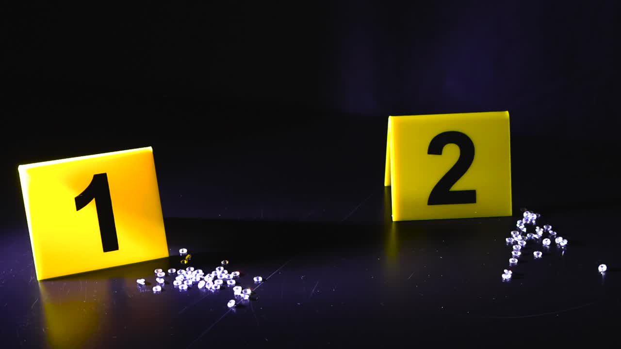 Yellow forensic evidence markers numbering pieces of proof like scattered diamonds on a dark surface, symbolizing a jewel heist, robbery, or high value theft investigation at a crime scene