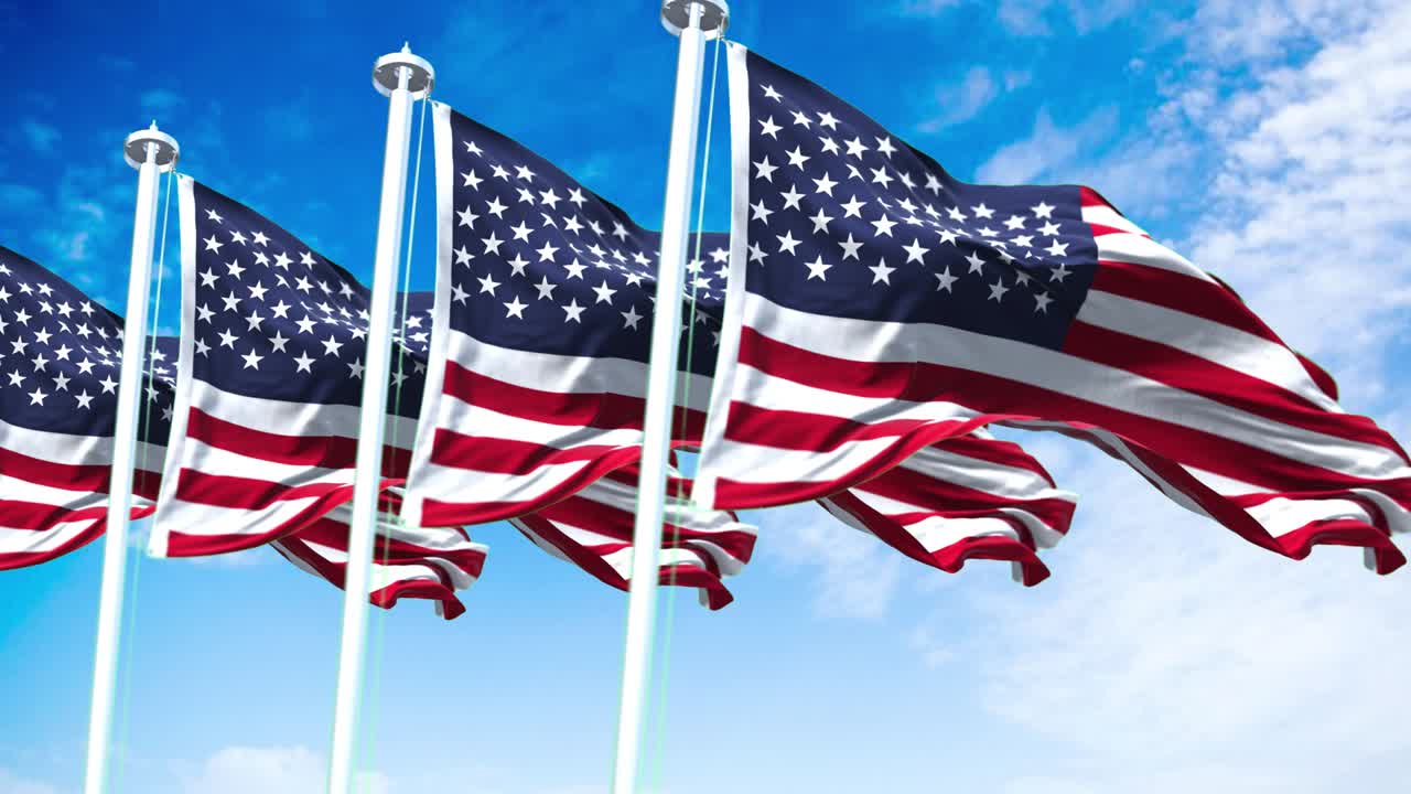 Four flags of the United States of America waving in the wind
