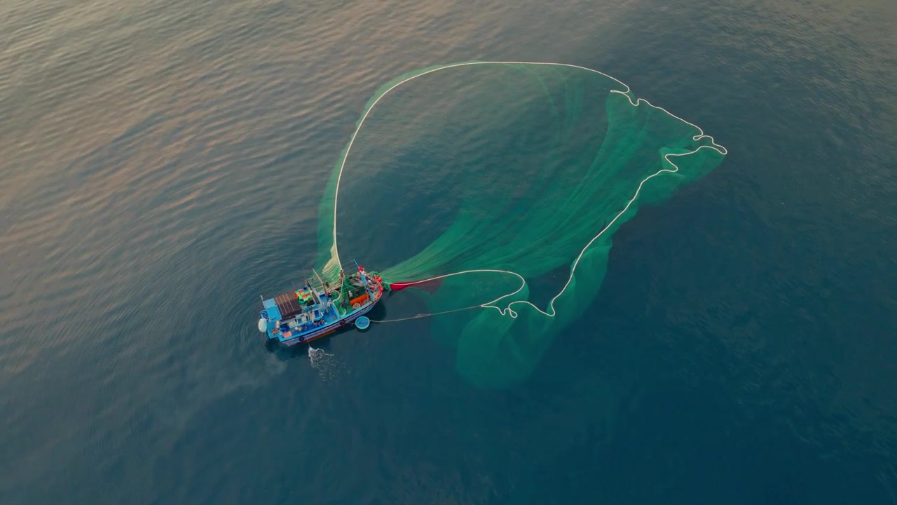 Drone view a fishing boat is netting fishes on Doc Let sea - Khanh Hoa province, central Vietnam