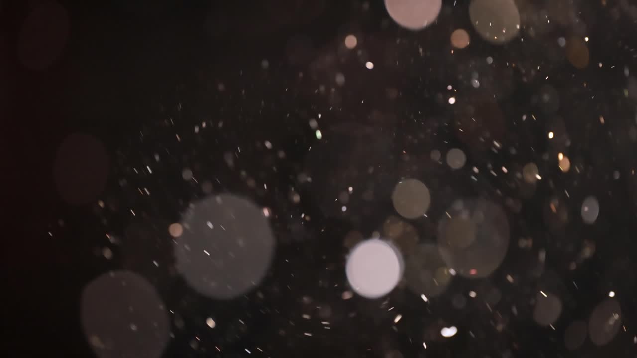 bokeh de partículas abstractas flotantes sobre fondo oscuro