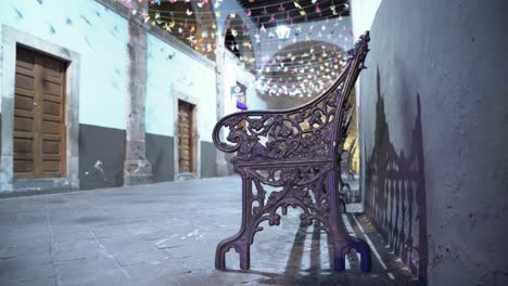 metal bench in a narrow street