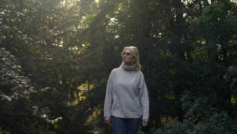 Girl-walking-in-deep-forest