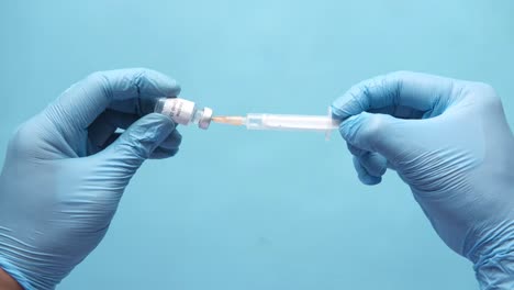 preparing a covid-19 vaccine injection