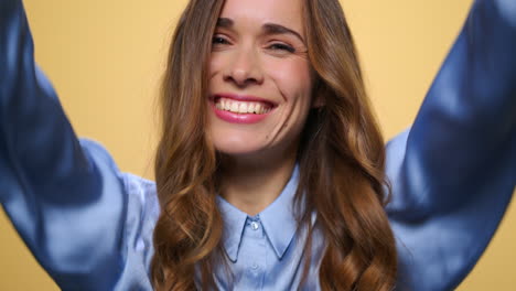 excited woman showing yes gesture. executive enjoying success with hands up