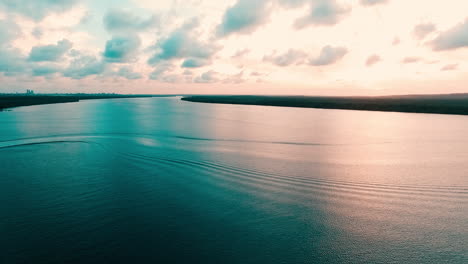 magical waves on the river at joão pessoa, brazil, in golden hour, at sunrise