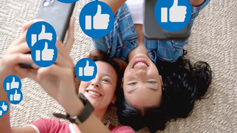 taking selfies and smiling, women surrounded by thumbs-up icons animation