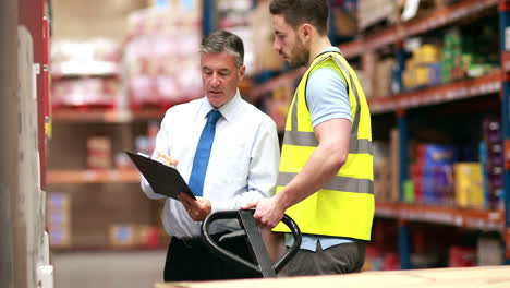 warehouse worker talking with his manager