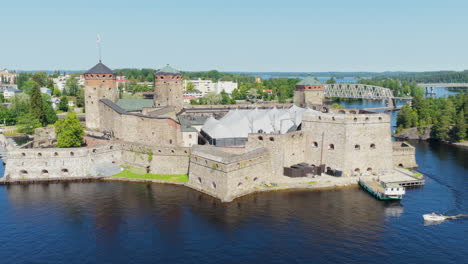 aerial view orbiting the saint olaf's castle, summer day in savonia, finland