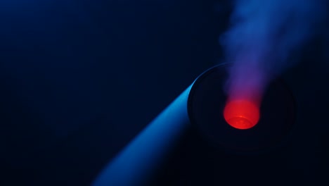 working a humidifier with a red circular light in the middle