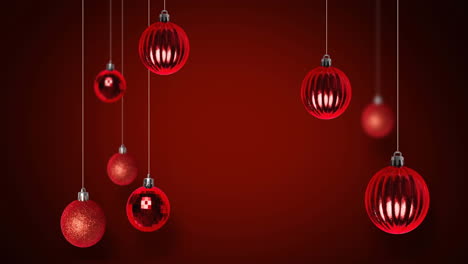 animación de bolas de navidad rojas sobre fondo rojo