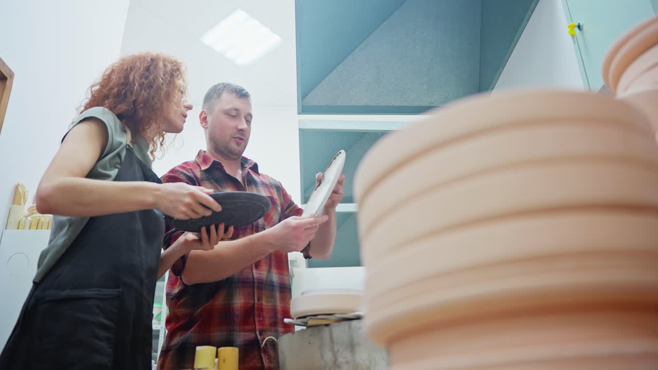 Potters Inspecting Ceramic Plates
