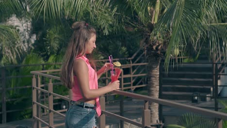 attractive young lady tastes delicious watermelon beverage