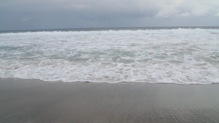 Foamy Waves Crashing on Beach