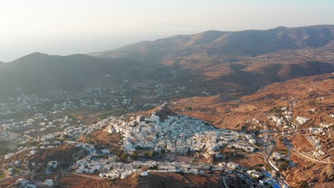 aerial view of ios chora side pan during sunset in greek island