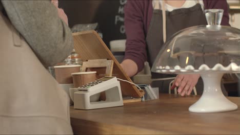 Woman-Paying-for-Coffee-Using-Contactless