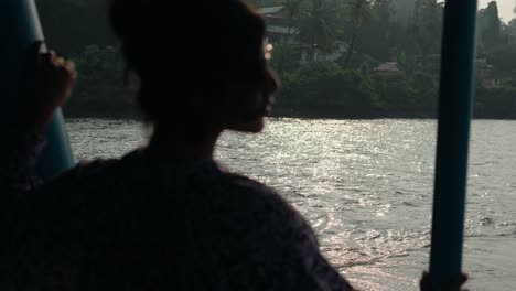 young indian woman embarking on a traditional boat journey in india