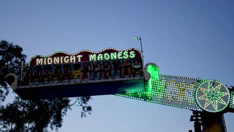 amusement park ride in motion with colorful lights