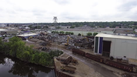 aerial footage of metal recycling plant on the mississippi river