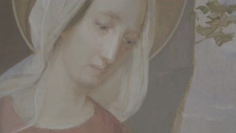 painting of mother mary holding the crown of thorns in her hand