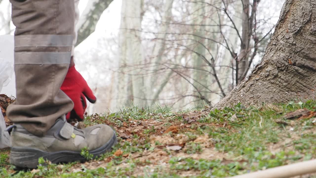 Park Worker Cleaning Up Debris