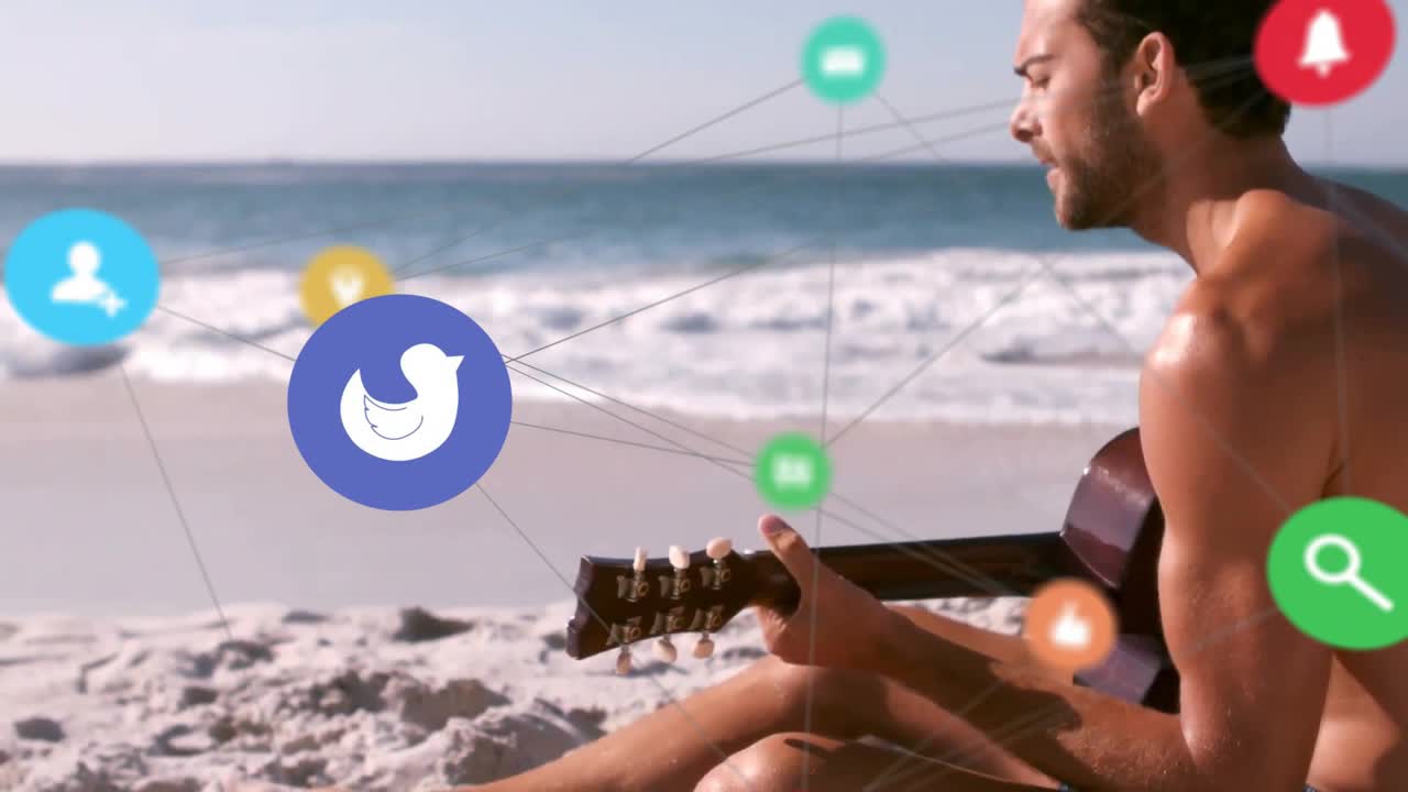 Playing guitar on beach, man surrounded by animation of social media icons