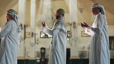 muslim men praying inside a mosque