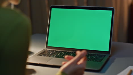 freelancer video calling mockup laptop in dark apartment close up. woman talking