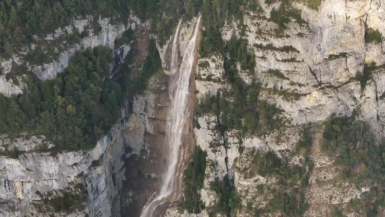 Cinematic overhead view of the Seerenbachfälle Falls located in the Graubünden region of Switzerland.