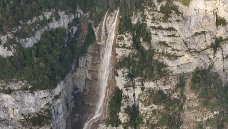 cinematic overhead view of the seerenbachfälle falls located in the graubünden region of switzerland.