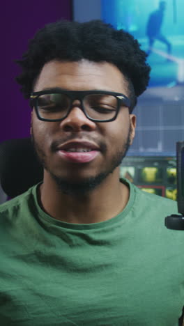 man in a home studio smiling at the camera