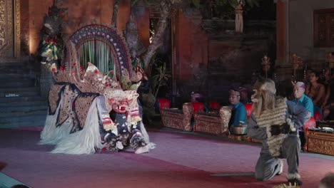 barong and monkey dance performance at ubud palace bali, indonesia - slow motion