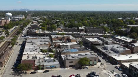 la grange, il on a sunny fall day, showcasing streets, buildings, and the suburban landscape with downtown chicago in background. crane up left zoom x1 day e