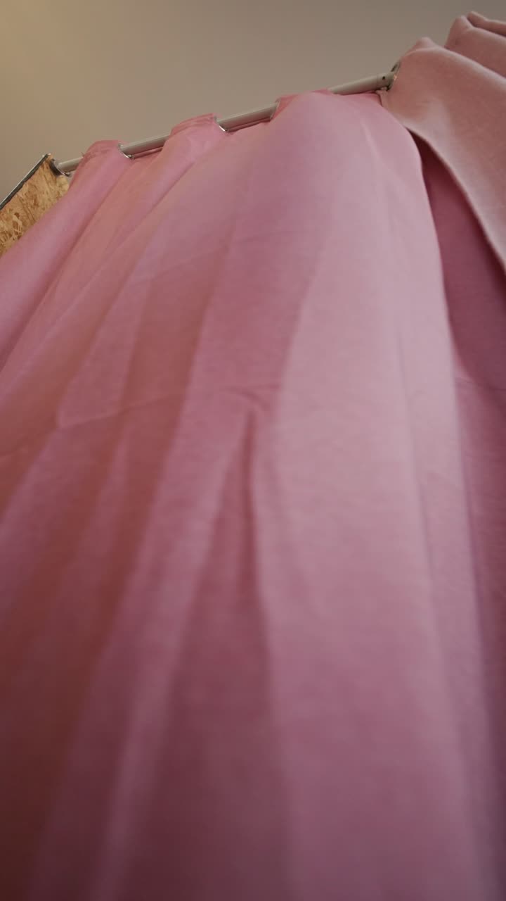 Woman in floral dress in a dressing room
