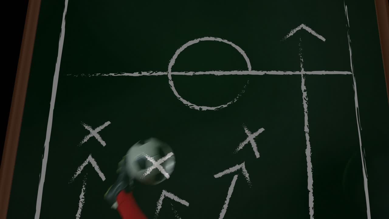 Mandlig spiller reagerer på en rullende bold, sparker den over et bræt med overlappende X-mærker for at vise fodboldspil