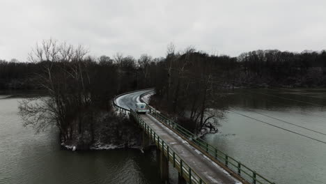 Aerial-View-Of-A-Car-Crossing-The-Road-Bridge-In-Lake-Sequoyah,-Arkansas-USA