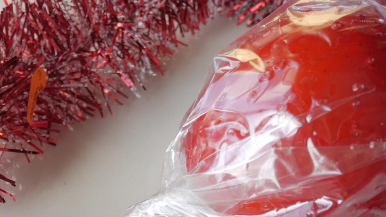 Slide shot of toffee apple and christmas decoration